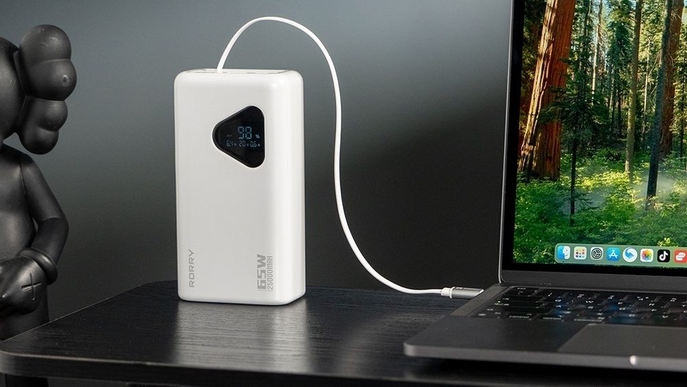 The power bank is charging the Mac.